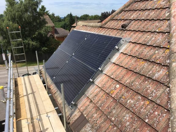 Scaffolding used because of the steep pitch of these solar panels.